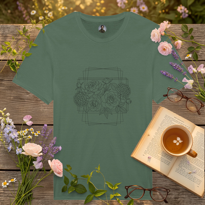 green coloured t-shirt on a picnic table surrounded by flowers, a book and a cup of tea